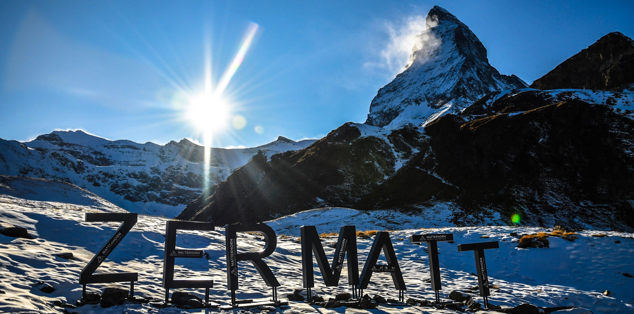 Some letters in the snow form the word 